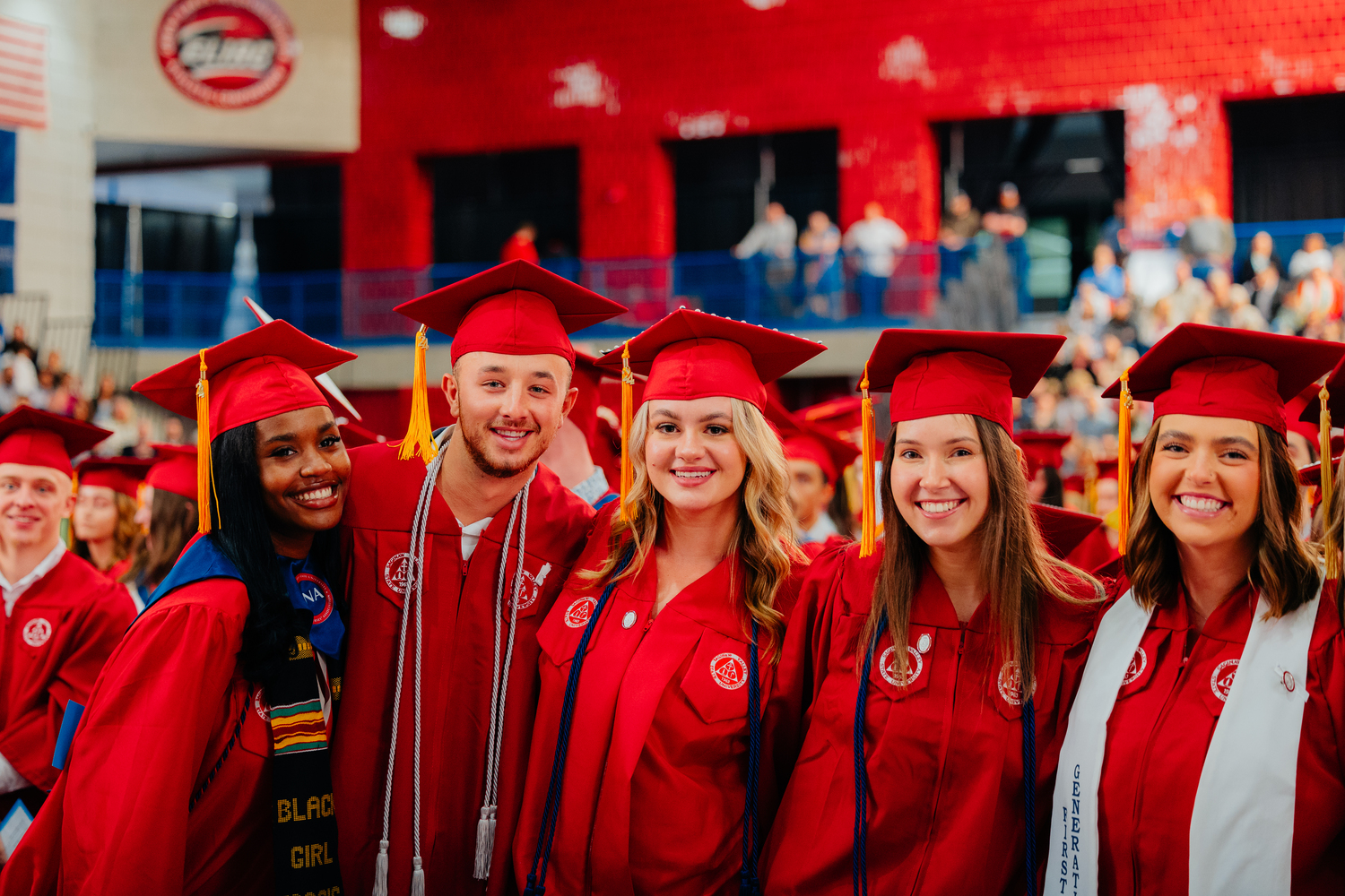 Group of graduates in red regalia